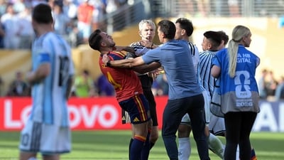 Lionel Scaloni tries to intervene as Leandro Paredes clashes with Eric Garcia. (AFP)