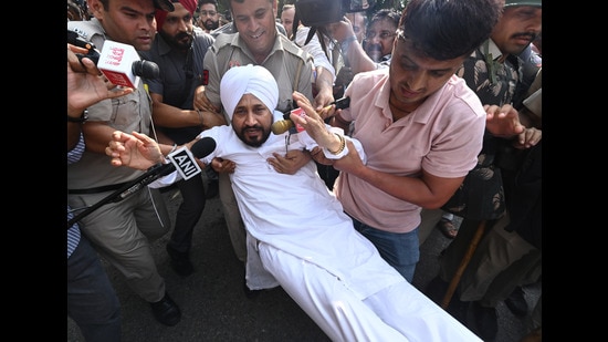 Congress’ Jalandhar MP and former Punjab chief minister Charanjit Singh Channi being detained by the Delhi Police on Tuesday. (RAJ K RAJ /HT PHOTO)