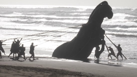 Christopher Nolan’s version of the Trojan Horse—35 feet tall and rearing on hind legs—was half buried in sand on the Atlantic coast.