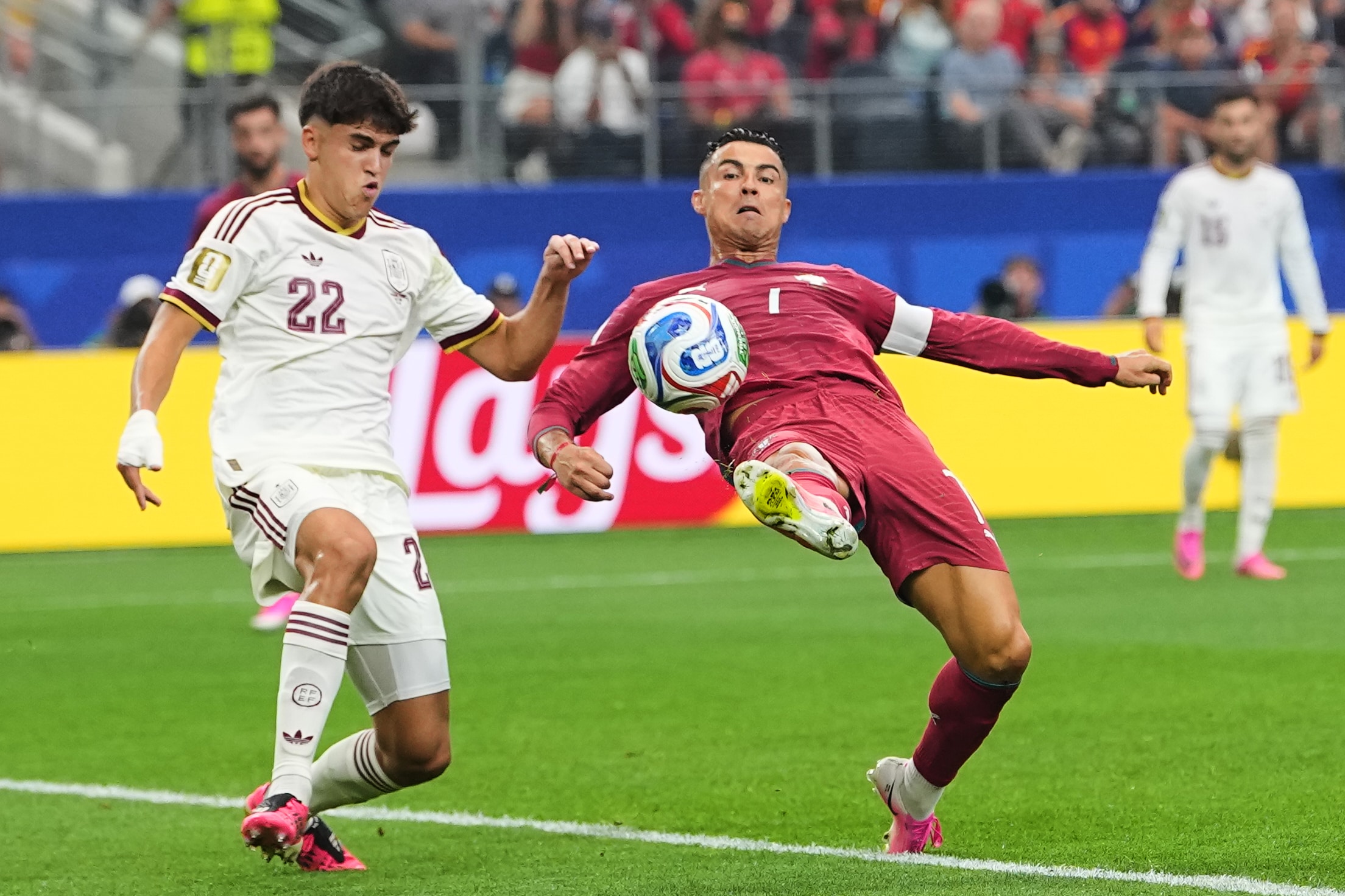 Cristiano Ronaldo (7) shoots a goal as Spain's Pau Cubarsi (22) defends during the World Cup round of 16 soccer match between Portugal and Spain (AP) Cristiano Ronaldo (7) shoots a goal as Spain's Pau Cubarsi (22) defends during the World Cup round of 16 soccer match between Portugal and Spain (AP)