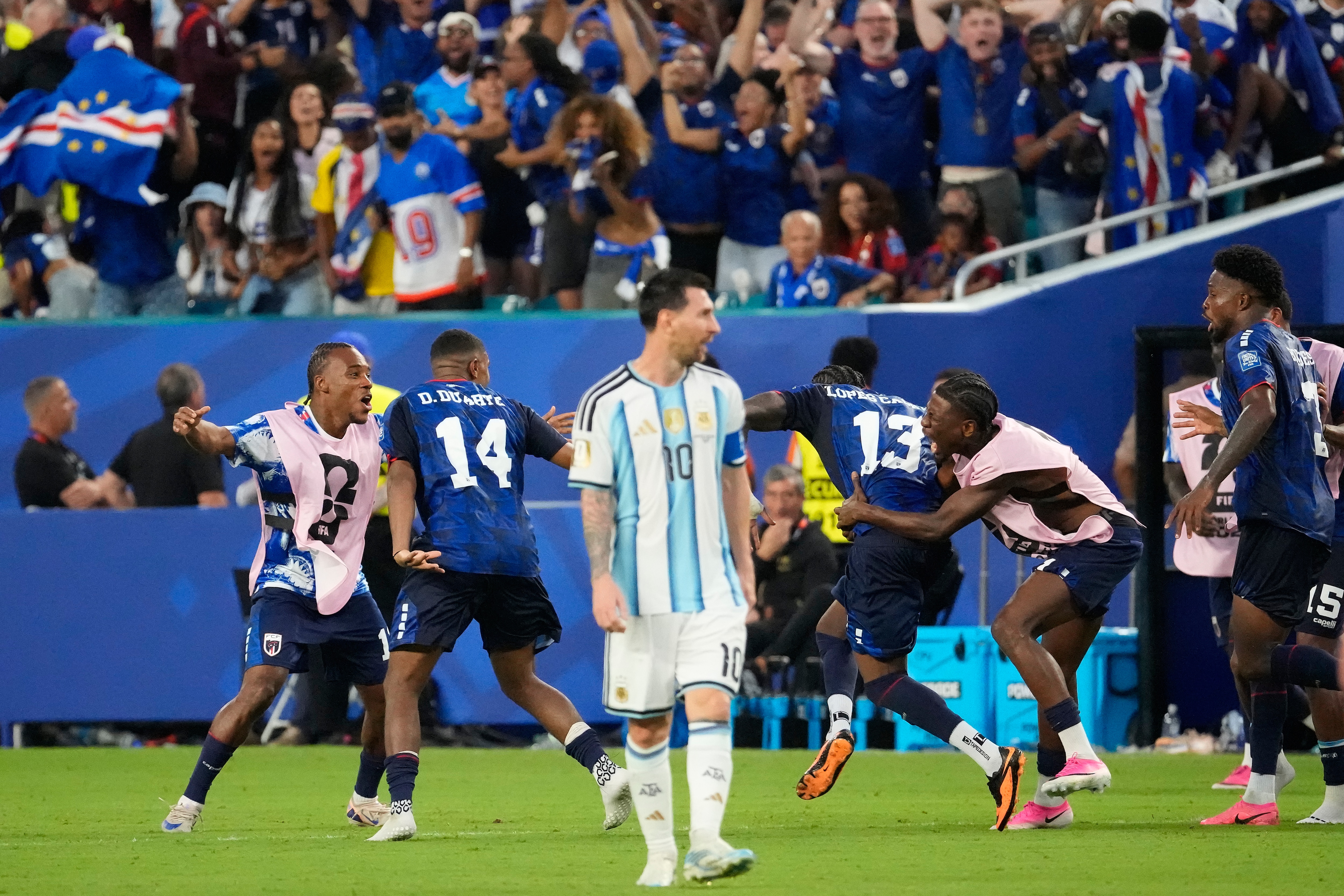 Sidny Lopes Cabral (13) celebrates with teammates as Argentina's Lionel Messi (10) looks on after scoring their second goal during the World Cup round of 32 soccer match between Argentina and Cape Verde (AP Photo/Chris Carlson) Sidny Lopes Cabral (13) celebrates with teammates as Argentina's Lionel Messi (10) looks on after scoring their second goal during the World Cup round of 32 soccer match between Argentina and Cape Verde (AP Photo/Chris Carlson)