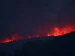Fire rages in the hills near the village of Cotignac, France, during a wildfire on Tuesday,