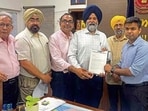 FICO members handing over a memorandum to DC Himanshu Jain in Ludhiana on Tuesday. (HT Photo)