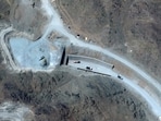 Vehicles at the western entrance of the Pickaxe Mountain tunnel complex adjacent to the Natanz Nuclear Facility near Natanz, Isfahan province, central Iran.