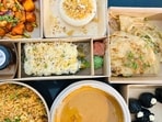 My Shoyu order came with sustainable kraft packaging, labelled boxes, a printed menu, and little jars of burnt chilli oil and soy. Nothing leaked. (Pic: Sanya Panwar)