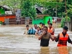 NDRF personnel rescue people affected by floods in Assam.