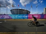 A cyclist passes participating nations' flags ahead of the Commonwealth Games 2026, in Glasgow, Scotland, Monday, July 20, 2026(PTI)