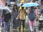People commute amid monsoon showers in Mumbai. (Anshuman Poyrekar/HT Photo)