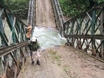 Police received the information at 9.30am that unknown persons blew up a bailey bridge constructed over the Namban Lok River. (HT Sourced Photo)