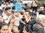 Residents of Shiddharth Colony, Chembur, held a protest on Tuesday to condemn the police lathi-charge on students during Monday’s protest near the Parliament in Delhi. (Raju Shinde/HT Photo)