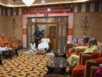 Shri Ram Janmabhoomi Teerth Kshetra Trust chairman Mahant Nritya Gopal Das with members during a special meeting in Ayodhya on Wednesday. (PTI PHOTO)