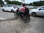 The cratered road near the Sector 69/78 dividing road on Airport Road, Mohali. (Sanjeev Sharma/HT)