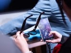 An attendee inspects a pair of Intelligent Eyewear smart glasses at a Samsung Unpacked launch event in London, UK, on July 22, 2026.