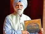Veteran journalist and author Roopinder Singh with his newly launched book ‘Gurdwaras-Abodes of the Guru’. (HT Photo)