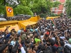 Scores of protesters attempt to breach through the security barricades at Jantar Mantar on Monday.
