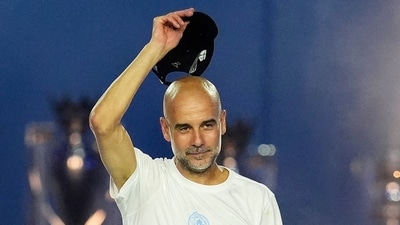 Pep Guardiola raises his hat to the crowd during a stage event. (Nick Potts/PA via AP) Pep Guardiola raises his hat to the crowd during a stage event. (Nick Potts/PA via AP)