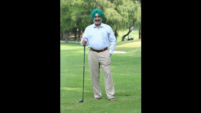 Chandigarh Golf Club president Major RS Virk (retd) striking a pose at the 10th hole on the sprawling green course. (Keshav Singh/HT)