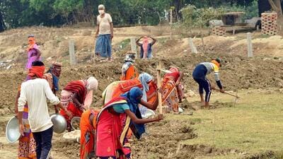 Labourers at work at a village in Varanasi. (ANI File) Labourers at work at a village in Varanasi. (ANI File)