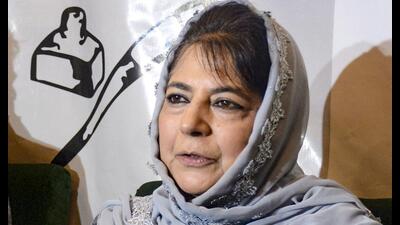 Peoples Democratic Party (PDP) president Mehbooba Mufti, along with former MLA Shoaib Lone, who recently joined the party, addresses a press conference at the party headquarters, in Srinagar, on Wednesday. (PTI)