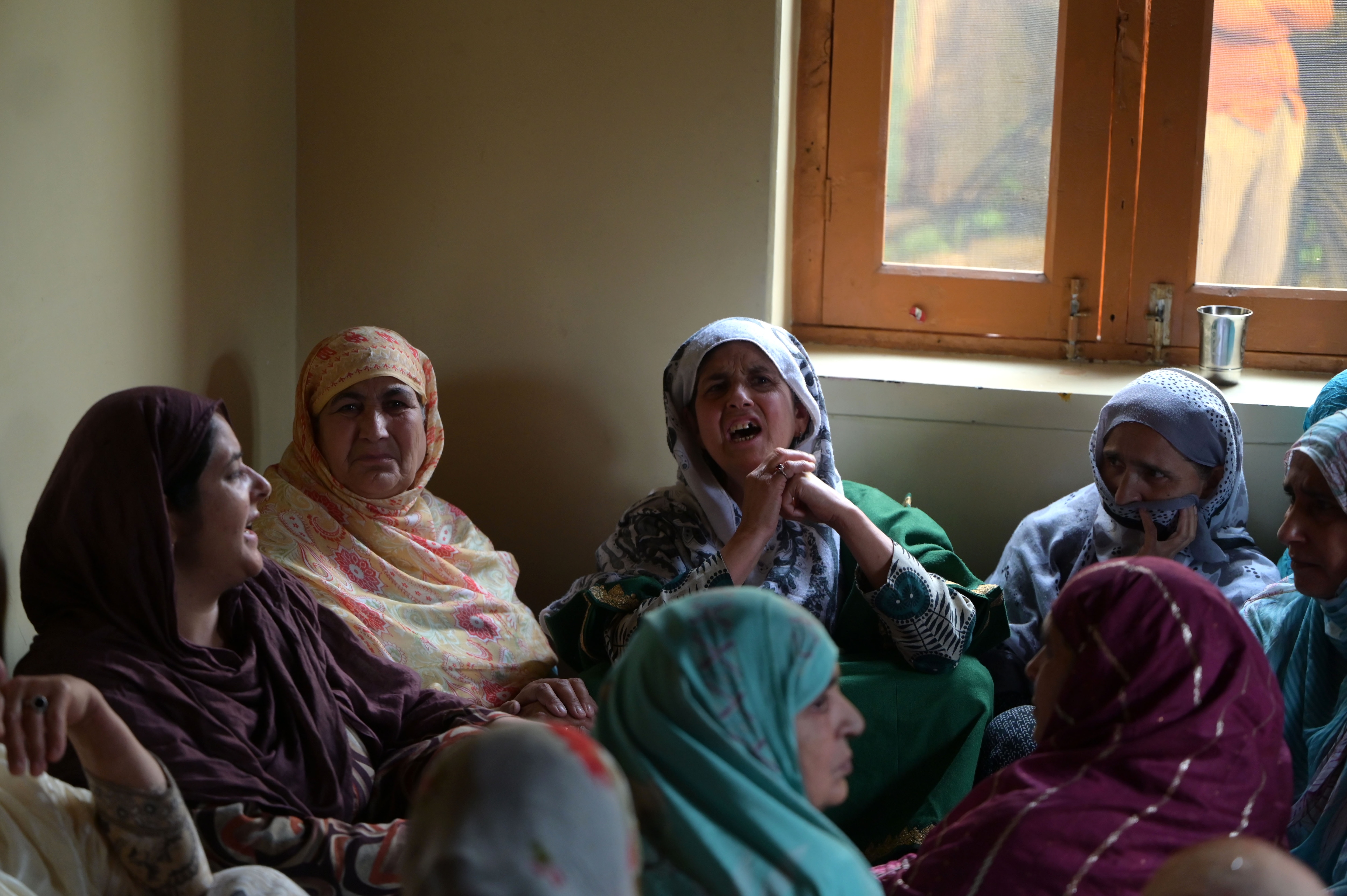 Family members of Ashiq Hussain, the policeman killed in an armed attack in Anantnag, mourn inside their home in Lalpora village in Budgam district. (Wasim Andarabi/Hindustan Times)