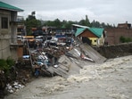 A view of the damaged shopping complex after it was washed away following continuous heavy rainfall at Beerwah in Budgam district some 3O kms from Srinagar, on Wednesday. (Waseem Andrabi/HT)