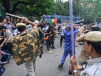 Security personnel lathi-charge protesters during the CJP demonstrations, in New Delhi.