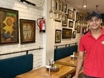 For the past year, Ayush Kumar has worked as a waiter at this neighbourhood café in Central Delhi. (HT Photo)