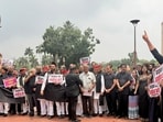 The opposition MPs held protests wearing black clothes against the government on Parliament premises.(HT Photo)