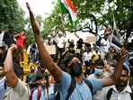 A Cockroach Janta Party (CJP) supporter shouts slogans at Jantar Mantar in New Delhi.