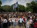 Supporters of India's Cockroach Janata Party (CJP) form a human chain to control demonstrators during the ongoing protests, two days after thousands of protesters marched towards parliament demanding the resignation of Education Minister Dharmendra Pradhan over examination paper leaks, at Jantar Mantar in New Delhi, India, July 22, 2026. REUTERS/Adnan Abidi