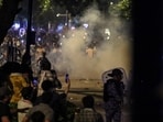 New Delhi: Security officials use tear gas during the ongoing protest over alleged irregularities in the NEET examination, near Jantar Mantar in New Delhi, Wednesday, July 22, 2026.