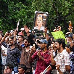 People gather at Sansad Marg to join the Cockroach Janta Party (CJP) protest demanding the resignation of Union Education Minister Dharmendra Pradhan over NEET paper leak issue, in New Delhi.