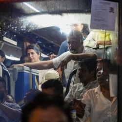 Lok Sabha LoP Rahul Gandhi and opposition MPs board a bus and head towards Gandhi Smriti, in New Delhi, Thursday.