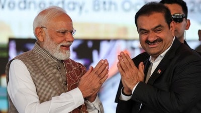 FILE PHOTO: India's Prime Minister Narendra Modi greets Indian businessman Gautam Adani, during the inauguration event of the Navi Mumbai International Airport in Ulwe, Raigad district, India, October 8, 2025. REUTERS/Francis Mascarenhas/File Photo (REUTERS)