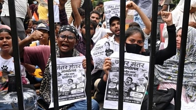 Protesters shout slogans as they carry posters in New Delhi on Wednesday. (AP Photo/Vipin) Protesters shout slogans as they carry posters in New Delhi on Wednesday. (AP Photo/Vipin)