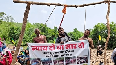 Tribals and farmers affected by the Ken-Betwa river-linking project stage a symbolic hanging satyagraha by placing nooses around their necks demanding full rehabilitation or state-sanctioned euthanasia, in Chhatarpur district, Madhya Pradesh. The 15-day protest ended after police removed them from site. (PTI) Tribals and farmers affected by the Ken-Betwa river-linking project stage a symbolic hanging satyagraha by placing nooses around their necks demanding full rehabilitation or state-sanctioned euthanasia, in Chhatarpur district, Madhya Pradesh. The 15-day protest ended after police removed them from site. (PTI)