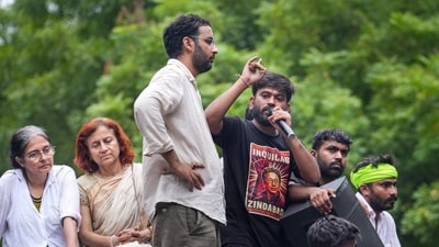 Cockroach Janata Party (CJP) founder Abhijit Debki speaks out following a protest demanding the resignation of Union Education Minister Dharmendra Pradhan. (PTI) Cockroach Janata Party (CJP) founder Abhijit Debki speaks out following a protest demanding the resignation of Union Education Minister Dharmendra Pradhan. (PTI)