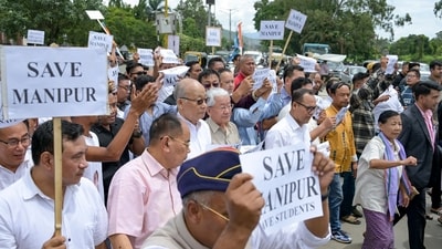 Congress workers hold placards as they take out a protest rally towards Lok Bhavan condemning the detention of Lok Sabha LoP Rahul Gandhi and other party leaders during a sit-in protest outside PM's residence in Delhi, and demanding accountability over alleged examination irregularities, in Imphal, Manipur. (PTI) Congress workers hold placards as they take out a protest rally towards Lok Bhavan condemning the detention of Lok Sabha LoP Rahul Gandhi and other party leaders during a sit-in protest outside PM's residence in Delhi, and demanding accountability over alleged examination irregularities, in Imphal, Manipur. (PTI)