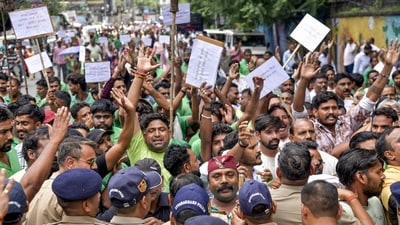 Uttarakhand Police personnel stop sanitation workers of the Dehradun Municipal Corporation during their march towards the Uttarakhand Secretariat while protesting over their six-point charter of demands, including a hike in honorarium, regularisation and recruitment, in Dehradun, Uttarakhand, Wednesday. (PTI) Uttarakhand Police personnel stop sanitation workers of the Dehradun Municipal Corporation during their march towards the Uttarakhand Secretariat while protesting over their six-point charter of demands, including a hike in honorarium, regularisation and recruitment, in Dehradun, Uttarakhand, Wednesday. (PTI)
