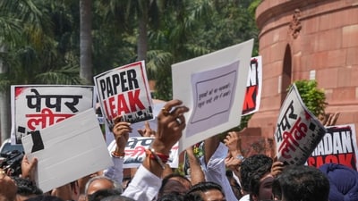 Opposition and ruling party MPs clash during their protests, amid the ongoing Monsoon session of Parliament, in New Delhi, Thursday, July 23, 2026. Opposition and ruling party MPs staged counter protests and raised slogans against each other outside Parliament on Thursday, signalling another day of potential disruptions in both houses of Parliament on the NEET paper leak issue. (PTI) Opposition and ruling party MPs clash during their protests, amid the ongoing Monsoon session of Parliament, in New Delhi, Thursday, July 23, 2026. Opposition and ruling party MPs staged counter protests and raised slogans against each other outside Parliament on Thursday, signalling another day of potential disruptions in both houses of Parliament on the NEET paper leak issue. (PTI)