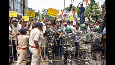 Security personnel stand guard as Congress workers march towards the BJP state headquarters during a protest against the detention of Congress MP and Lok Sabha Leader of the Opposition Rahul Gandhi in Ranchi on Thursday. (ANI) Security personnel stand guard as Congress workers march towards the BJP state headquarters during a protest against the detention of Congress MP and Lok Sabha Leader of the Opposition Rahul Gandhi in Ranchi on Thursday. (ANI)