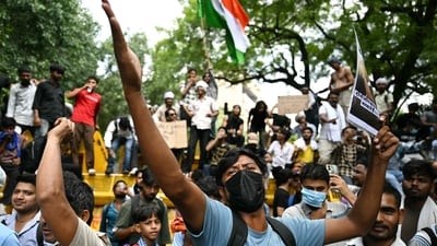 A Cockroach Janta Party (CJP) supporter chants slogans at Jantar Mantar in New Delhi. (AFP)