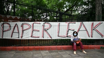 A Cockroach Janta Party (CJP) supporter sits at Jantar Mantar in New Delhi on July 23, 2026 during the ongoing protest to demand the resignation of India's Education Minister Dharmendra Pradhan over alleged NEET exam irregularities. (AFP) A Cockroach Janta Party (CJP) supporter sits at Jantar Mantar in New Delhi on July 23, 2026 during the ongoing protest to demand the resignation of India's Education Minister Dharmendra Pradhan over alleged NEET exam irregularities. (AFP)