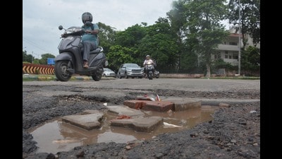 The road outside the main gate of Mansa Devi Temple is also in a poor condition. (Sant Arora/HT) The road outside the main gate of Mansa Devi Temple is also in a poor condition. (Sant Arora/HT)