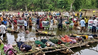 Tribals and farmers affected by the Ken-Betwa river-linking project stage a symbolic Chita Andolan (pyre protests), Jal Satyagraha and hanging satyagraha by placing nooses around their necks, over their demands of better compensation and rehabilitation, in Chhatarpur district, Madhya Pradesh. The 15-day protest ended after police removed them from site. (PTI) Tribals and farmers affected by the Ken-Betwa river-linking project stage a symbolic Chita Andolan (pyre protests), Jal Satyagraha and hanging satyagraha by placing nooses around their necks, over their demands of better compensation and rehabilitation, in Chhatarpur district, Madhya Pradesh. The 15-day protest ended after police removed them from site. (PTI)