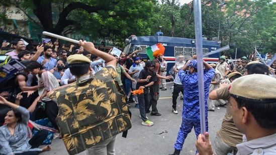 Security personnel lathi-charge protesters during the CJP demonstrations, in New Delhi.