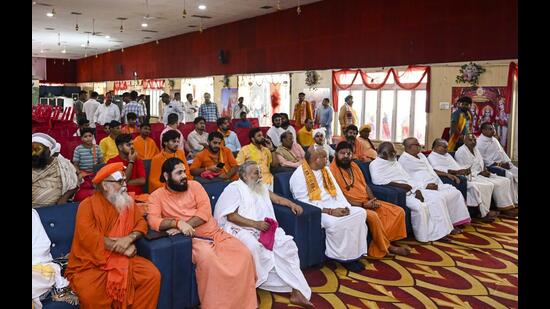 Seers from Ayodhya’s mutts, temples and akharas, along with Vishwa Hindu Parishad (VHP) functionaries, during a meeting to deliberate on issues relating to the Ram temple, in Ayodhya on Thursday. (PTI Photo)