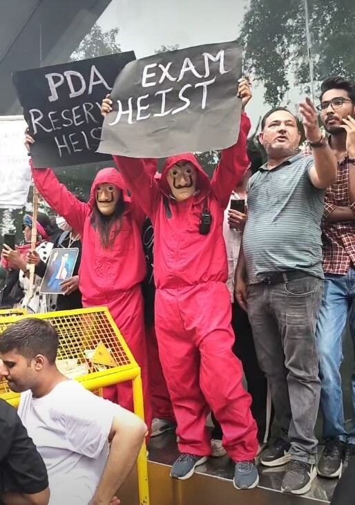 Marching from Janpath in New Delhi, protesters channelled Money Heist in the show's iconic red jumpsuits and masks.