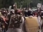 A video on X showed the villagers confronting the police team on a main road (Videograb)