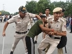 Police personnel carry out a lathi charge on protesters during the protest march against the alleged NEET paper leak from Jantar Mantar to Parliament House, in New Delhi on Monday.